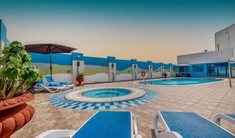 Outdoor pool with loungers at The Park Hotel.