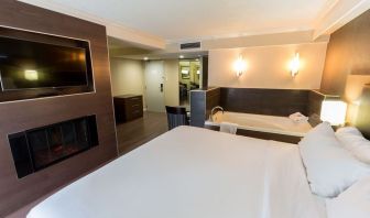 Cozy king room with TV and hot tub at Holiday Inn Express Edmonton Downtown.