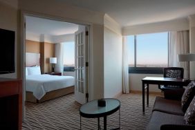 Spacious king suite with lounge area at Washington Dulles Marriott Suites.