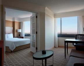 Spacious king suite with lounge area at Washington Dulles Marriott Suites.