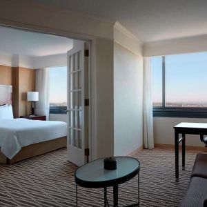 Spacious king suite with lounge area at Washington Dulles Marriott Suites.