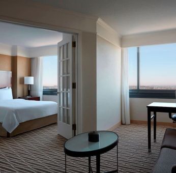 Spacious king suite with lounge area at Washington Dulles Marriott Suites.