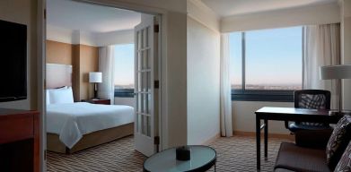 Spacious king suite with lounge area at Washington Dulles Marriott Suites.