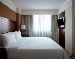 Romantic king room with TV at Washington Dulles Marriott Suites.