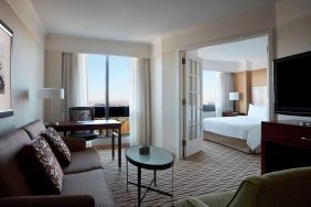 Spacious day use room with lounge and TV at Washington Dulles Marriott Suites.