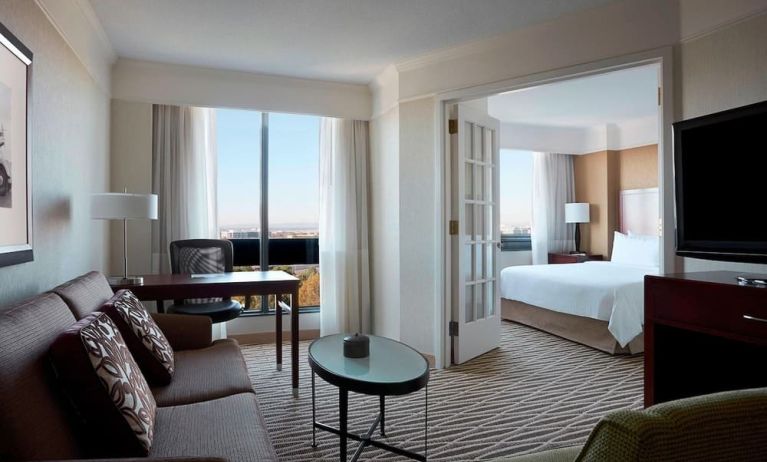 Spacious day use room with lounge and TV at Washington Dulles Marriott Suites.