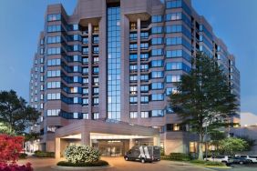 Hotel exterior at night at Washington Dulles Marriott Suites.