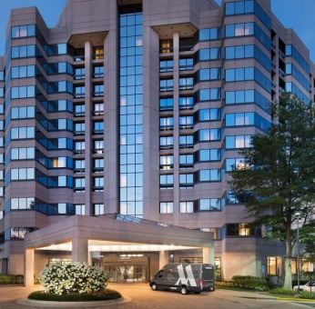 Hotel exterior at night at Washington Dulles Marriott Suites.