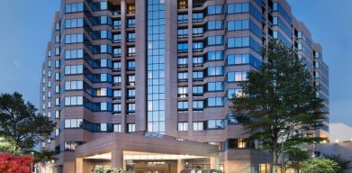 Hotel exterior at night at Washington Dulles Marriott Suites.