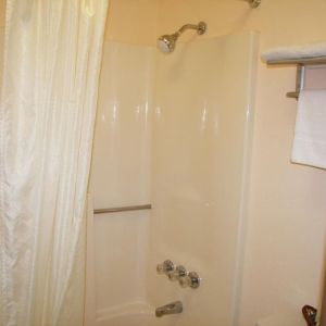 Guest bathroom with shower at Stardust Motel Redding.