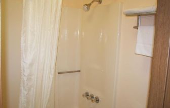 Guest bathroom with shower at Stardust Motel Redding.