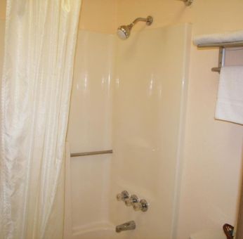 Guest bathroom with shower at Stardust Motel Redding.