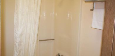 Guest bathroom with shower at Stardust Motel Redding.