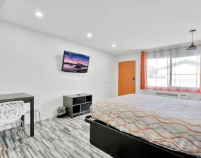 Day room with natural light and TV at Tradewinds Motel.