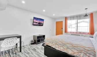 Day room with natural light and TV at Tradewinds Motel.