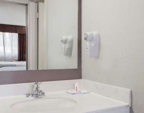 Day room with guest bathroom at Days Inn By Wyndham St Augustine/Historic Downtown.