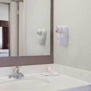 Day room with guest bathroom at Days Inn By Wyndham St Augustine/Historic Downtown.