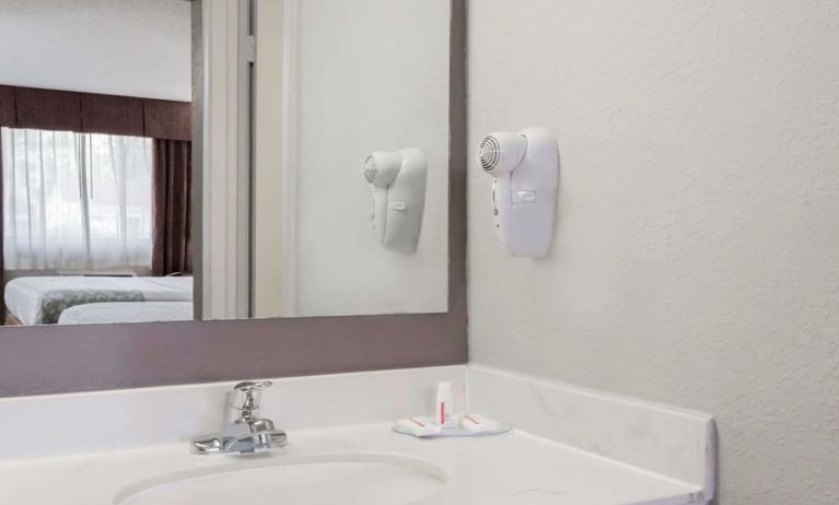 Day room with guest bathroom at Days Inn By Wyndham St Augustine/Historic Downtown.