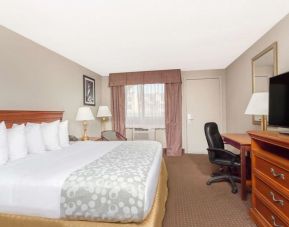 Day use room with TV and work desk at Days Inn By Wyndham St Augustine/Historic Downtown.