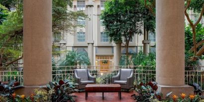 Lounge chairs in green lobby at Hyatt Regency Greenwich.