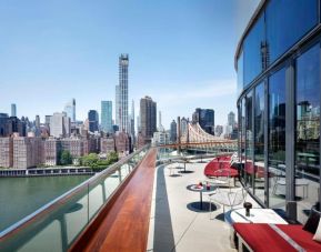 Outdoor terrace with city views at Graduate By Hilton New York.