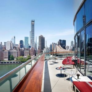 Outdoor terrace with city views at Graduate By Hilton New York.