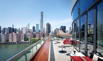 Outdoor terrace with city views at Graduate By Hilton New York.