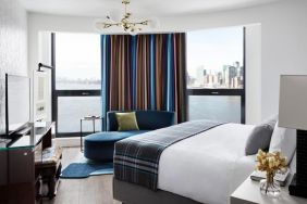 King room with natural light and city views at Graduate By Hilton New York.