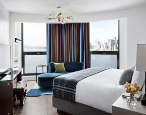 King room with natural light and city views at Graduate By Hilton New York.