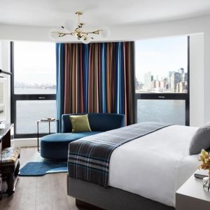 King room with natural light and city views at Graduate By Hilton New York.