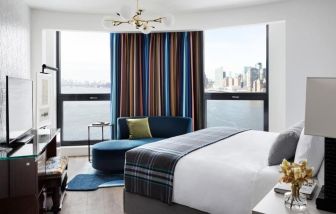 King room with natural light and city views at Graduate By Hilton New York.