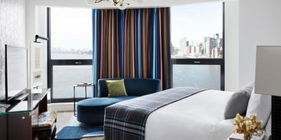 King room with natural light and city views at Graduate By Hilton New York.