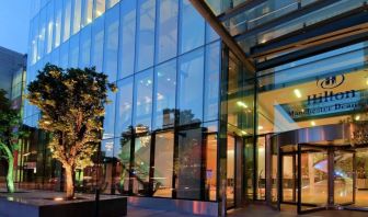 Hotel exterior at night at Hilton Manchester Deansgate.