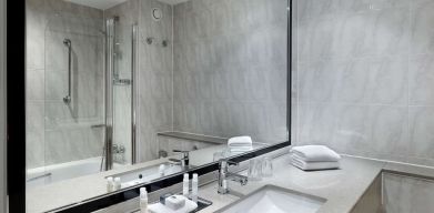 Guest bathroom with shower at DoubleTree By Hilton Woking.