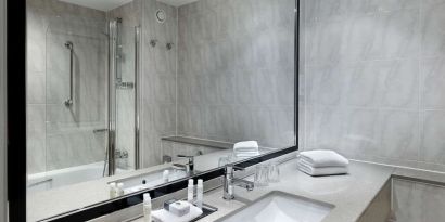 Guest bathroom with shower at DoubleTree By Hilton Woking.