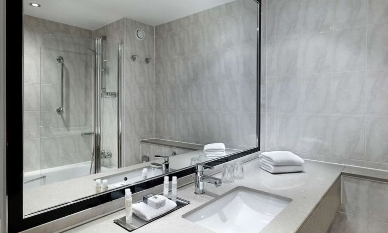 Guest bathroom with shower at DoubleTree By Hilton Woking.