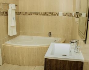 Guest bathroom with tub at Heavenly Boutique Guesthouse. 