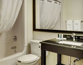 Guest bathroom with shower and tub at Comfort Inn Sherbrooke.