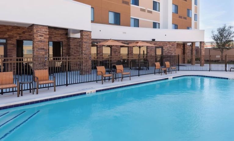 Refreshing outdoor pool at Courtyard By Marriott Houston North/ Shenandoah.