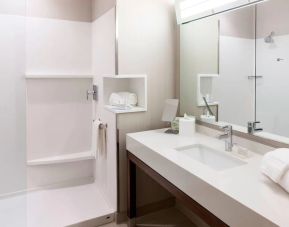 Guest bathroom with shower at Courtyard By Marriott Houston North/ Shenandoah.  