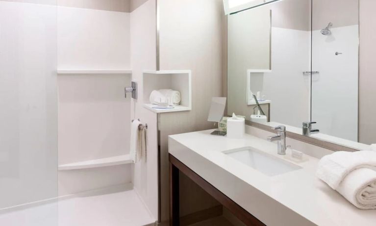 Guest bathroom with shower at Courtyard By Marriott Houston North/ Shenandoah.  