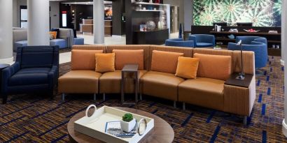 Lobby and coworking lounge at Courtyard By Marriott Houston North/ Shenandoah.