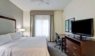 Cozy king room with work desk at Homewood Suites By Hilton Newark-Cranford.