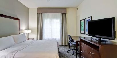 Cozy king room with work desk at Homewood Suites By Hilton Newark-Cranford.