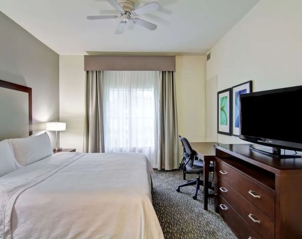 Cozy king room with work desk at Homewood Suites By Hilton Newark-Cranford.