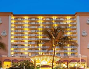 Hotel exterior at night at Ramada Plaza Marco Polo Beach Resort.