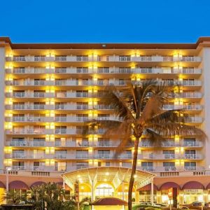 Hotel exterior at night at Ramada Plaza Marco Polo Beach Resort.