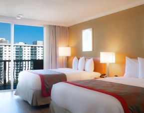 Two queen beds at Ramada Plaza Marco Polo Beach Resort.