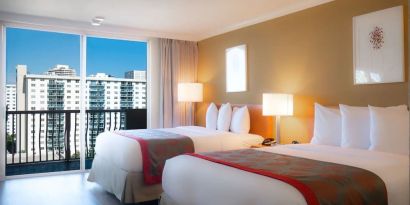 Two queen beds at Ramada Plaza Marco Polo Beach Resort.