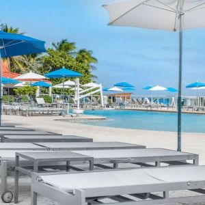 Sun loungers and umbrellas at Ramada Plaza Marco Polo Beach Resort.